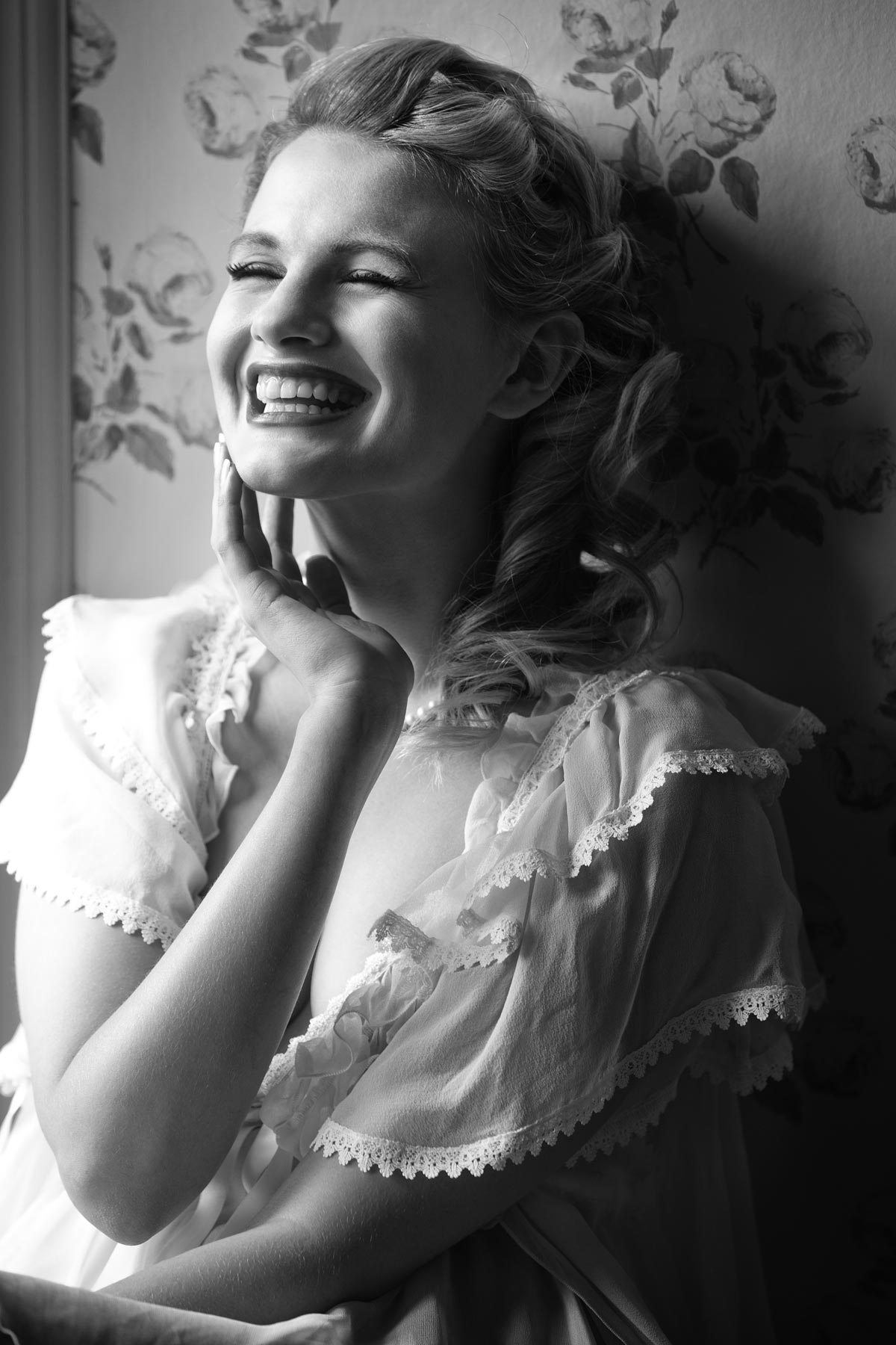 Chloe-Jasmine Whichello laughing in an English Rose setting. Mono print