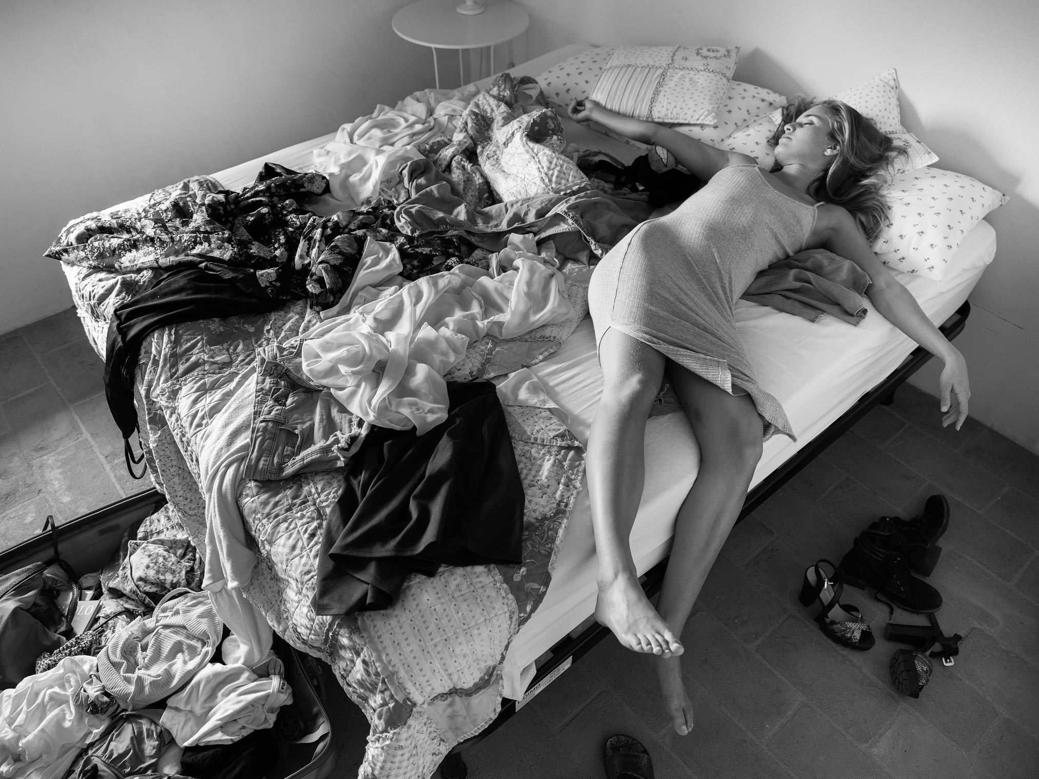 Terez Kočová is exhausted on the bed surrounded by her floordrobe after a hard three days of shooting with Damien Lovegrove.